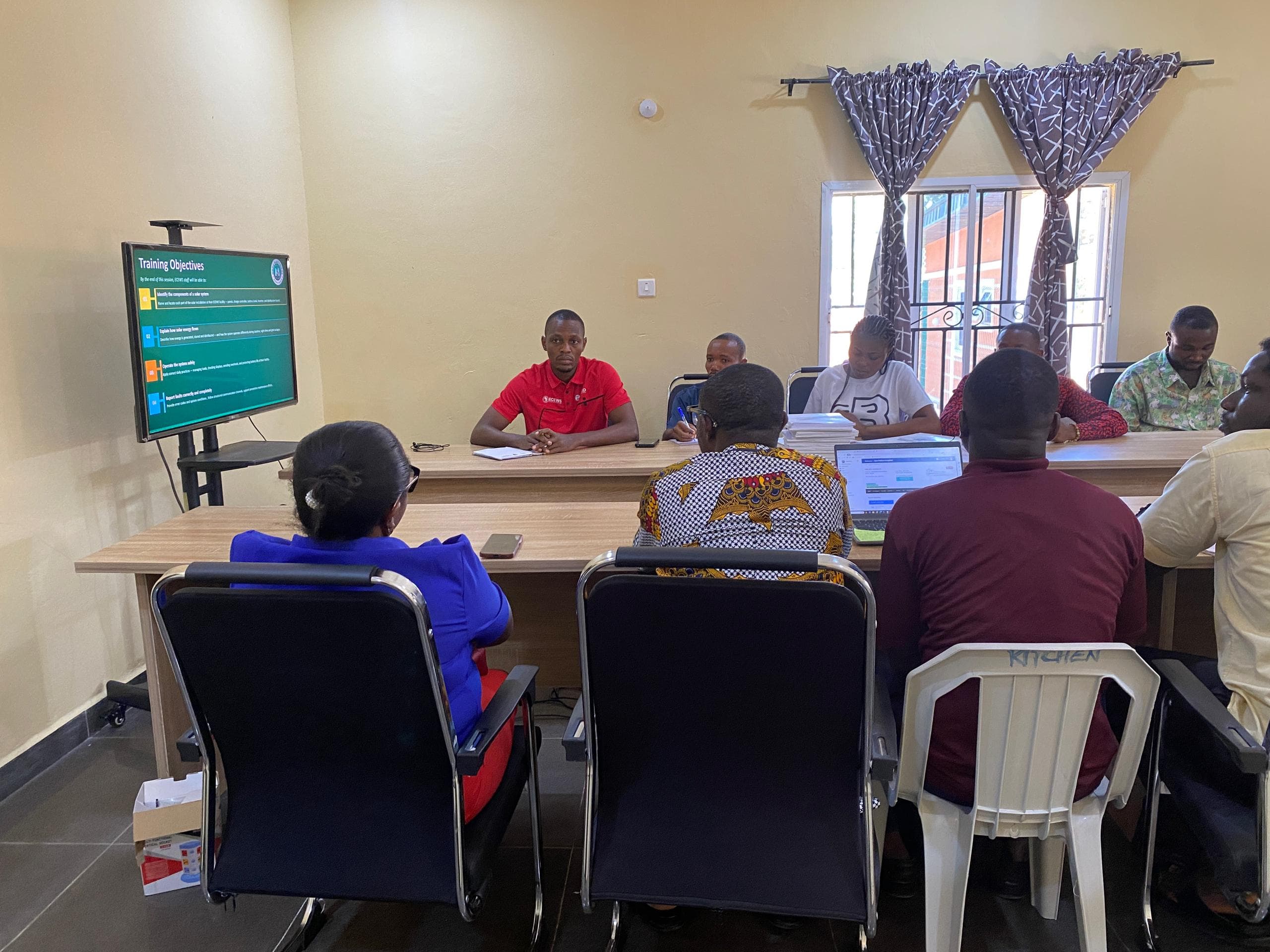 Trainees reviewing solar training objectives