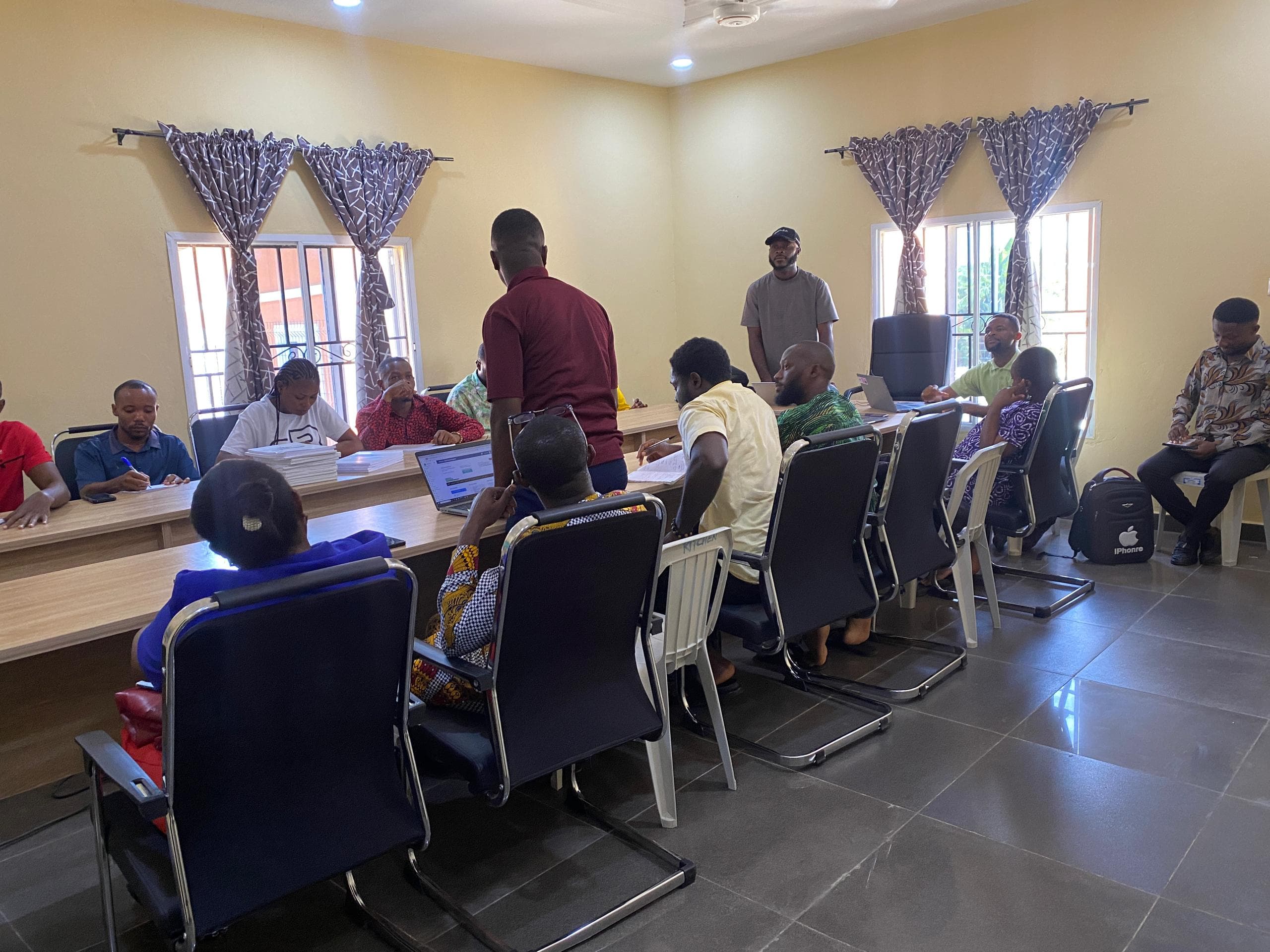 Instructor discussing renewable energy with trainees